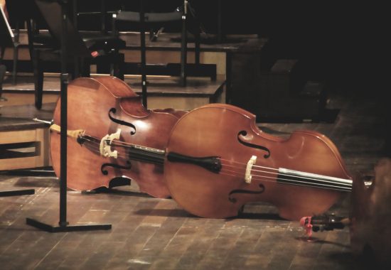 Cello music instruments on stage in concert hall Cello music instruments on stage in concert hall